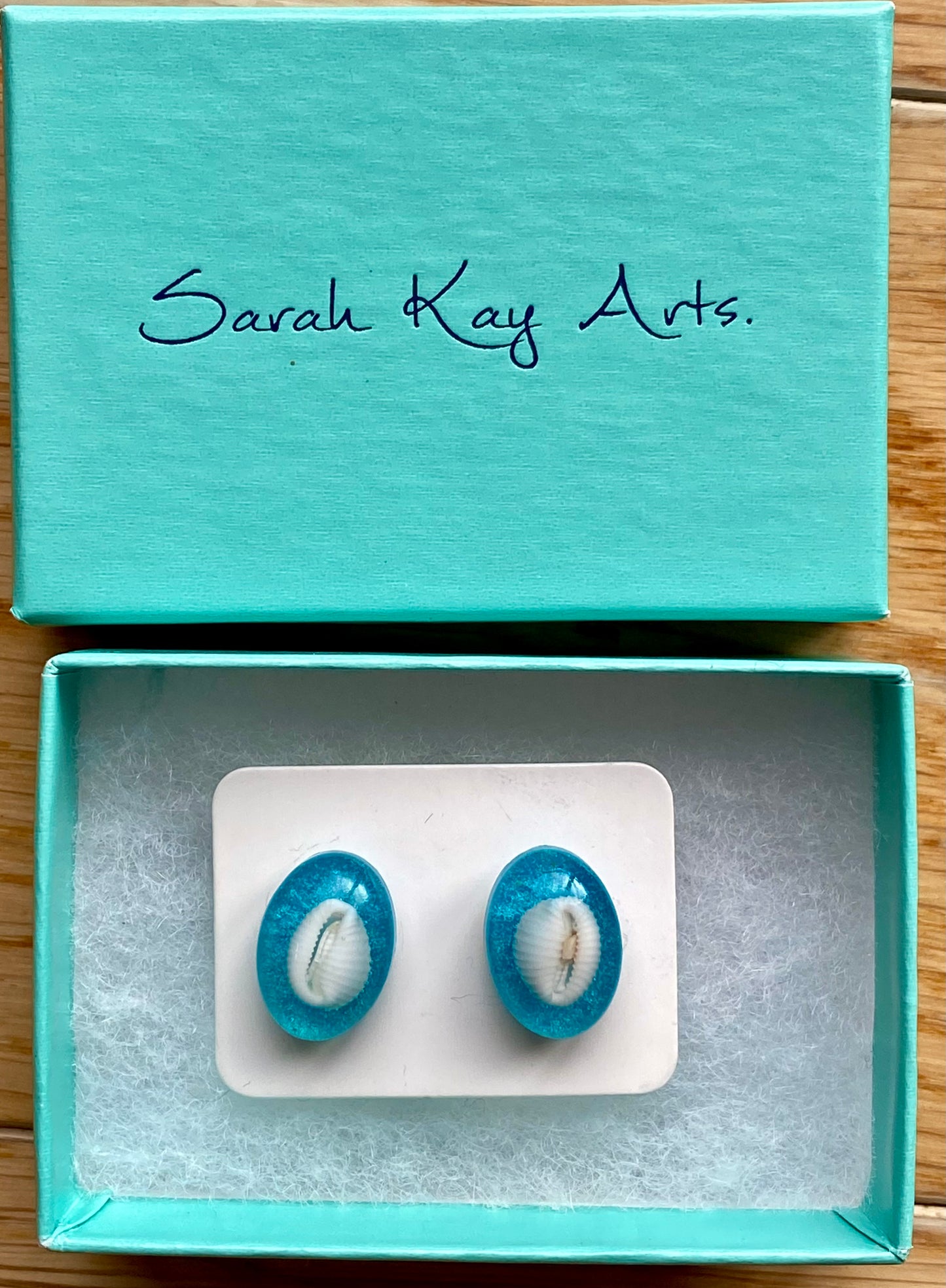 Cowrie Shell studs.