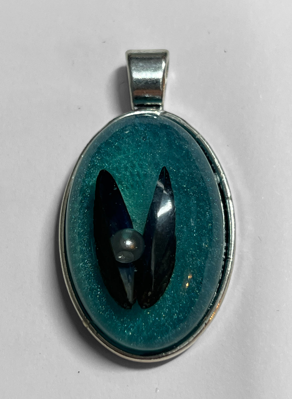 Mussel shell pendant.