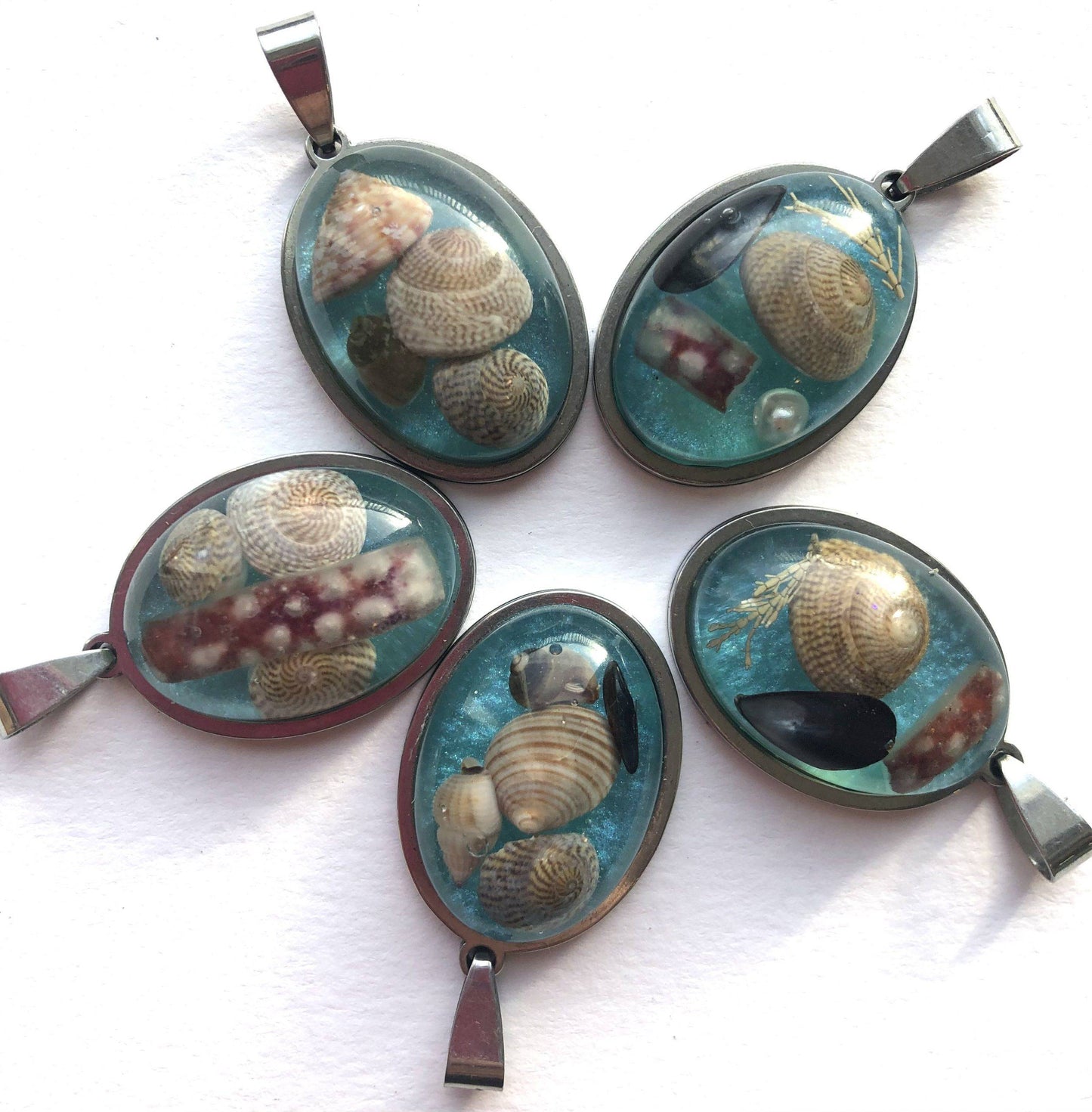 Sea blue beach treasure pendants.