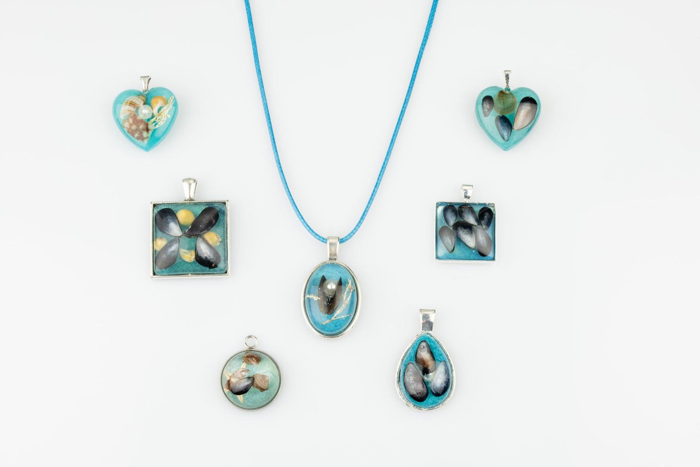 Sea blue beach treasure pendants.