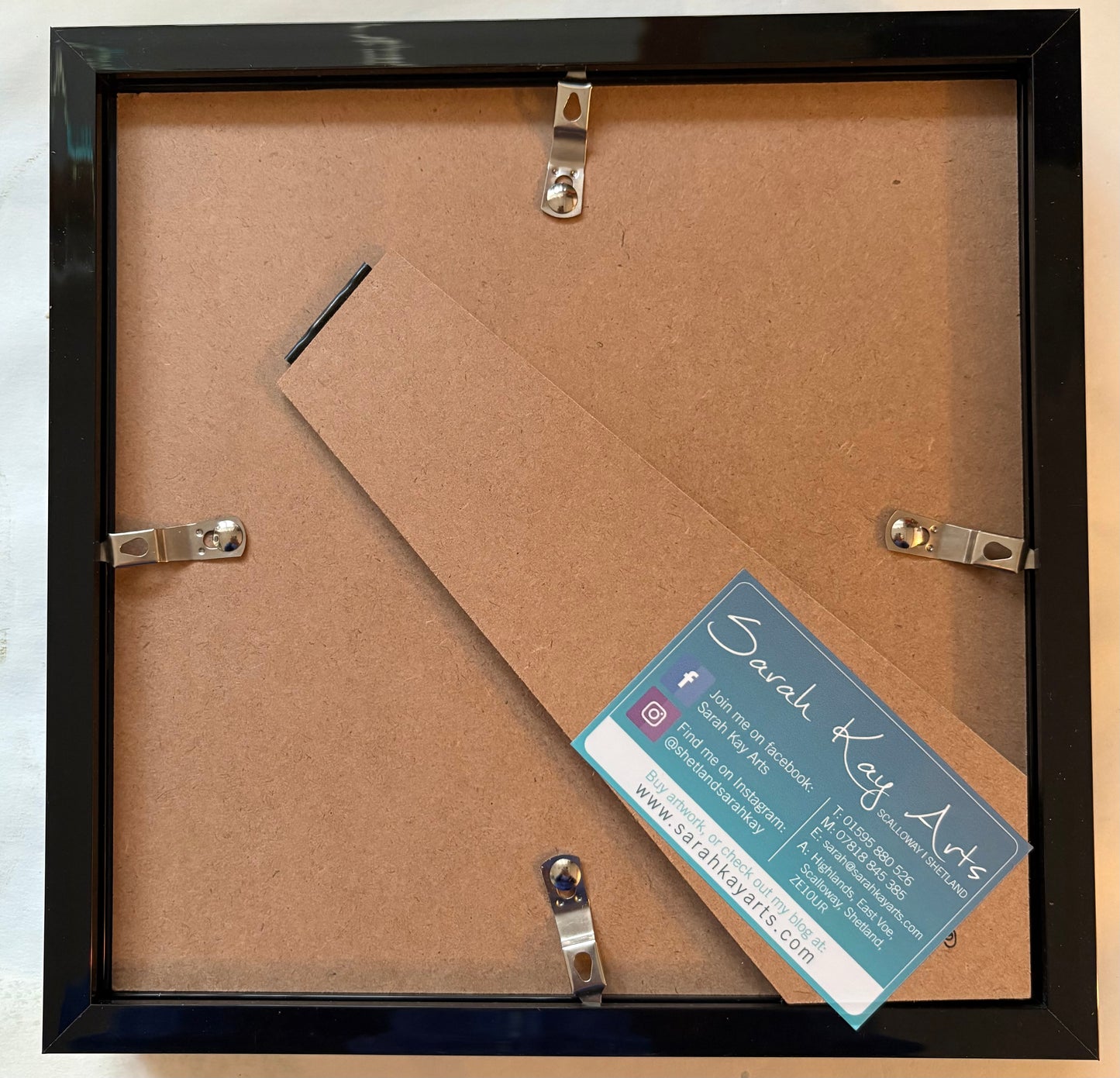 Green sea glass spiral art.