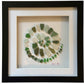 Green sea glass spiral art.