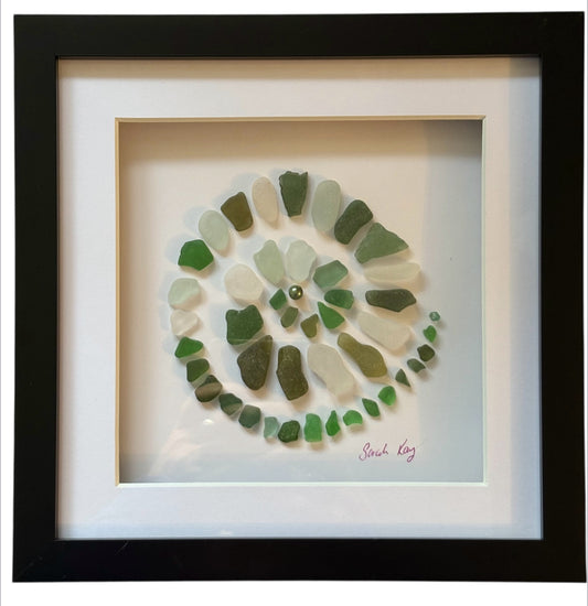 Green sea glass spiral art.