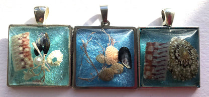 Sea blue beach treasure pendants.